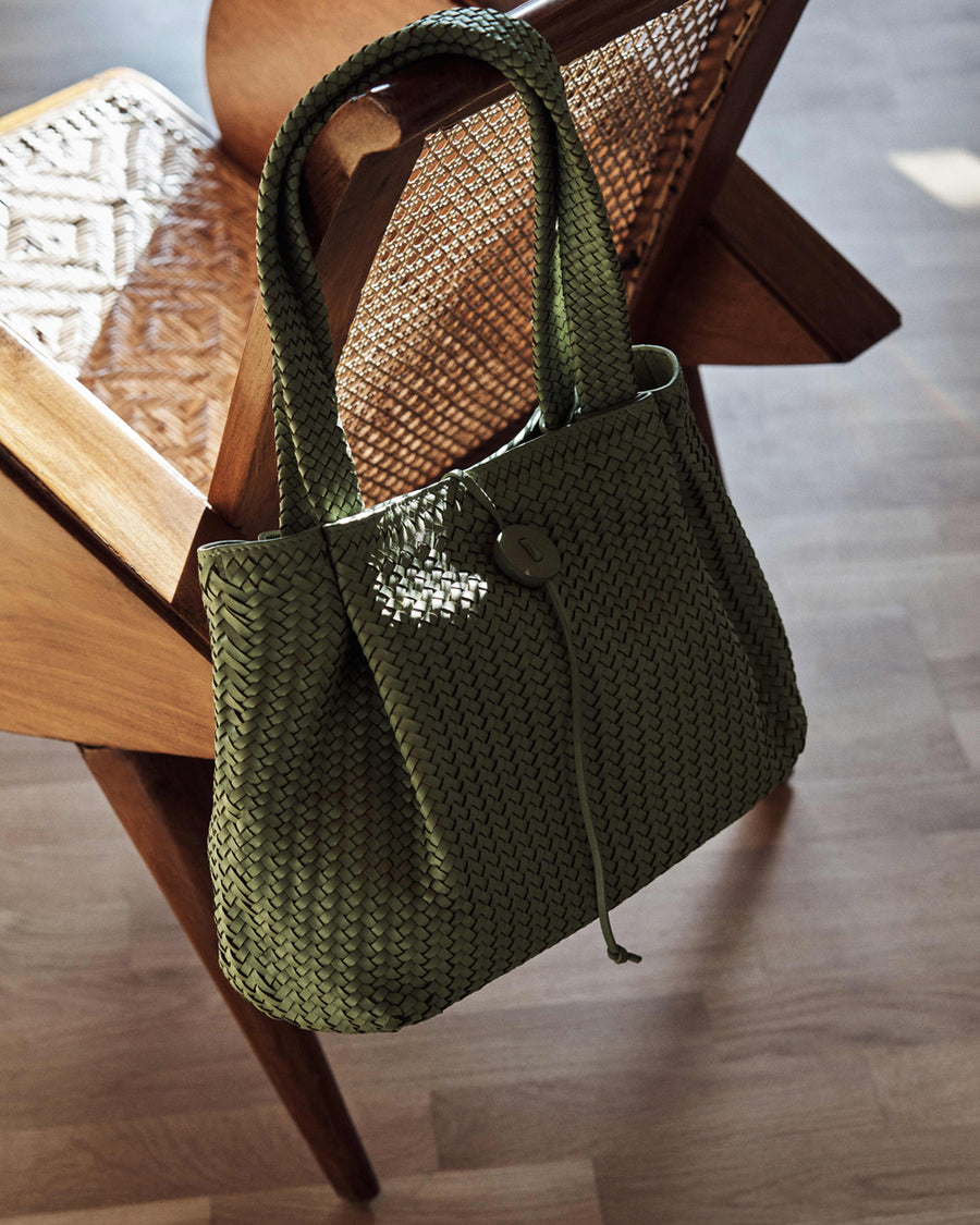 Green handwoven bag in Varana’s london showroom