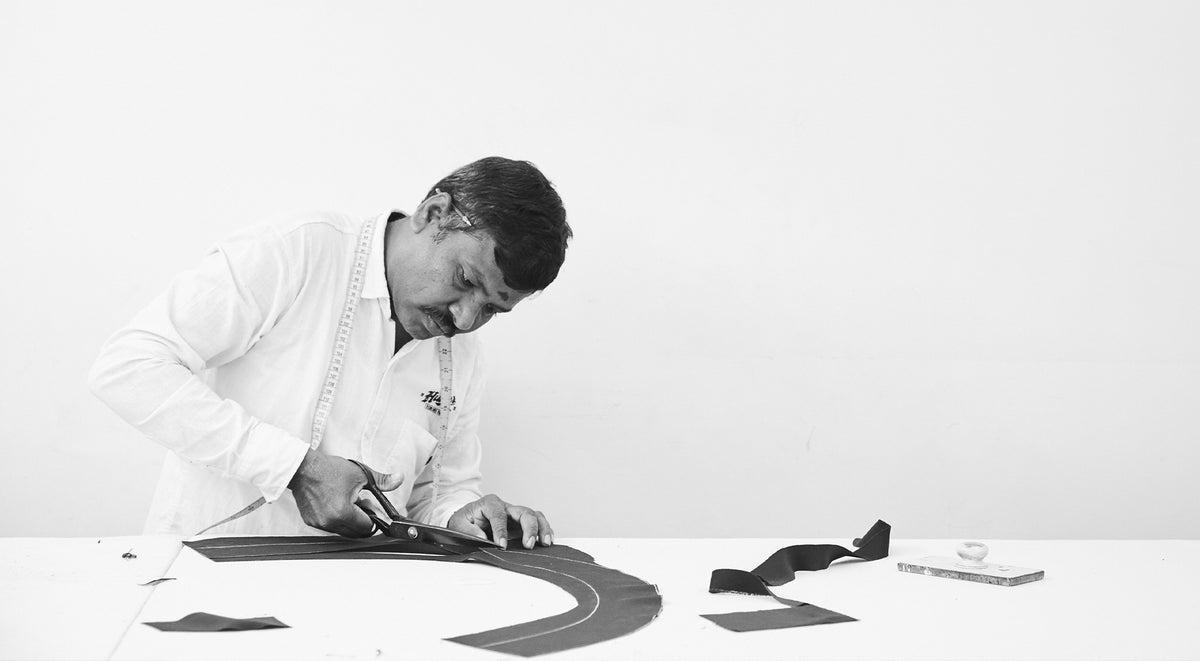 Skilled craftsman using scissors to create a custom piece